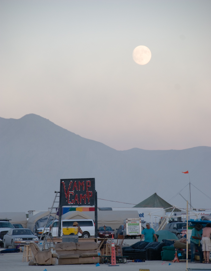 Vamp Camp rises beneath a full moon
